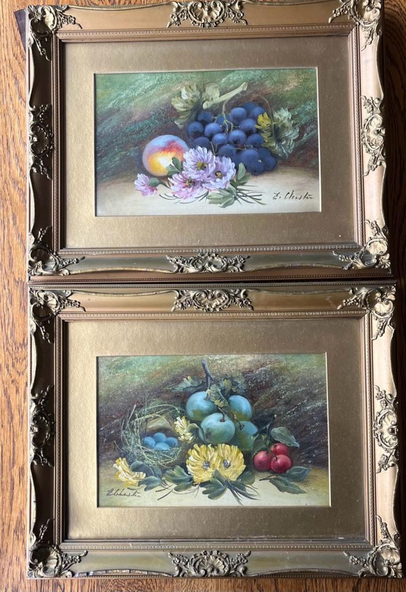 A PAIR OF GILT FRAMED HAND PAINTED STILL LIFE WATERCOLOURS WITH OIL HIGHLIGHTS, SIGNED E.CHESTER, 36