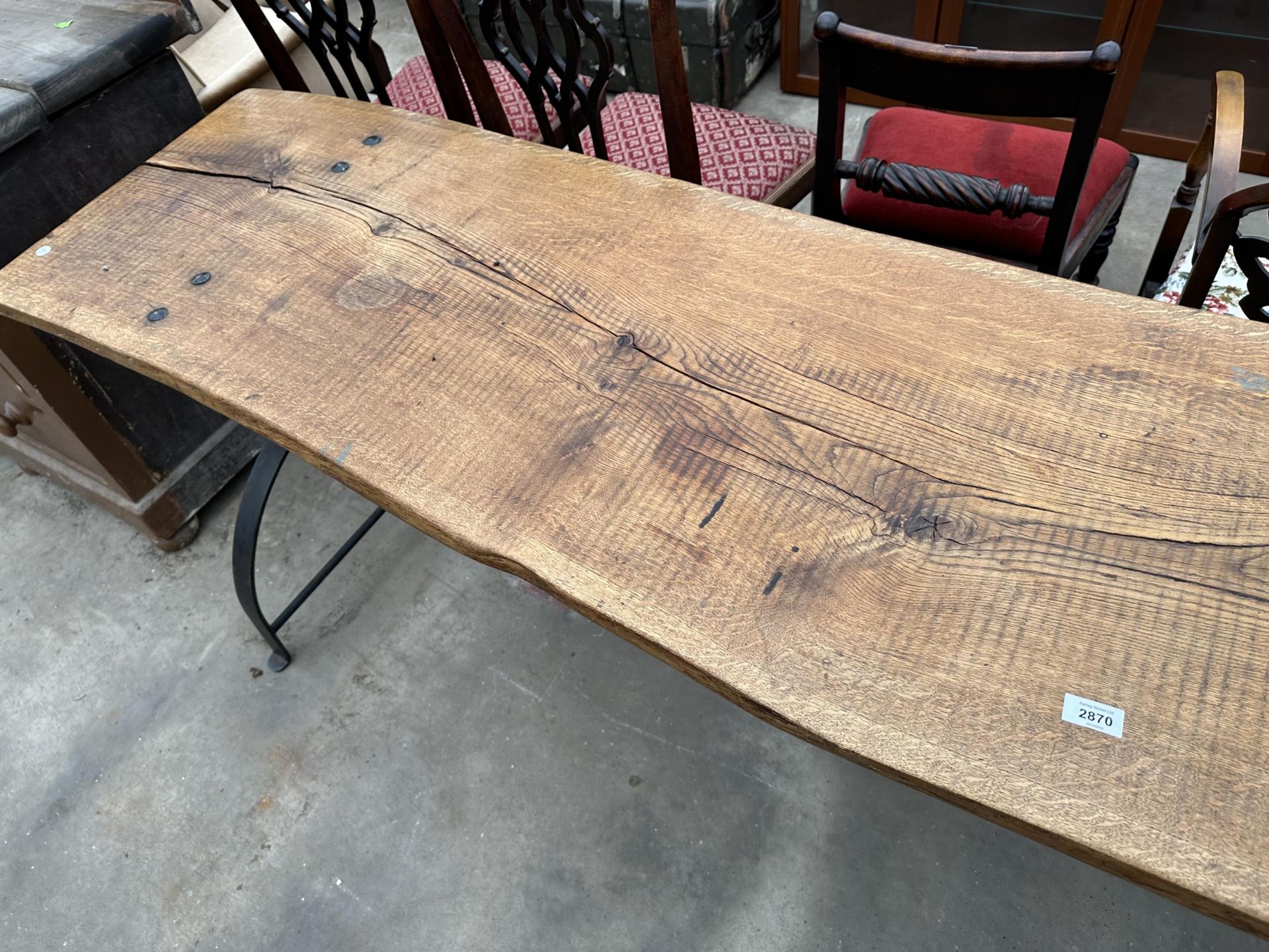 A LARGE RUSTIC DINING TABLE WITH CAST IRON STIRRUP SHAPED END LEGS, 86 X 22" - Image 3 of 5