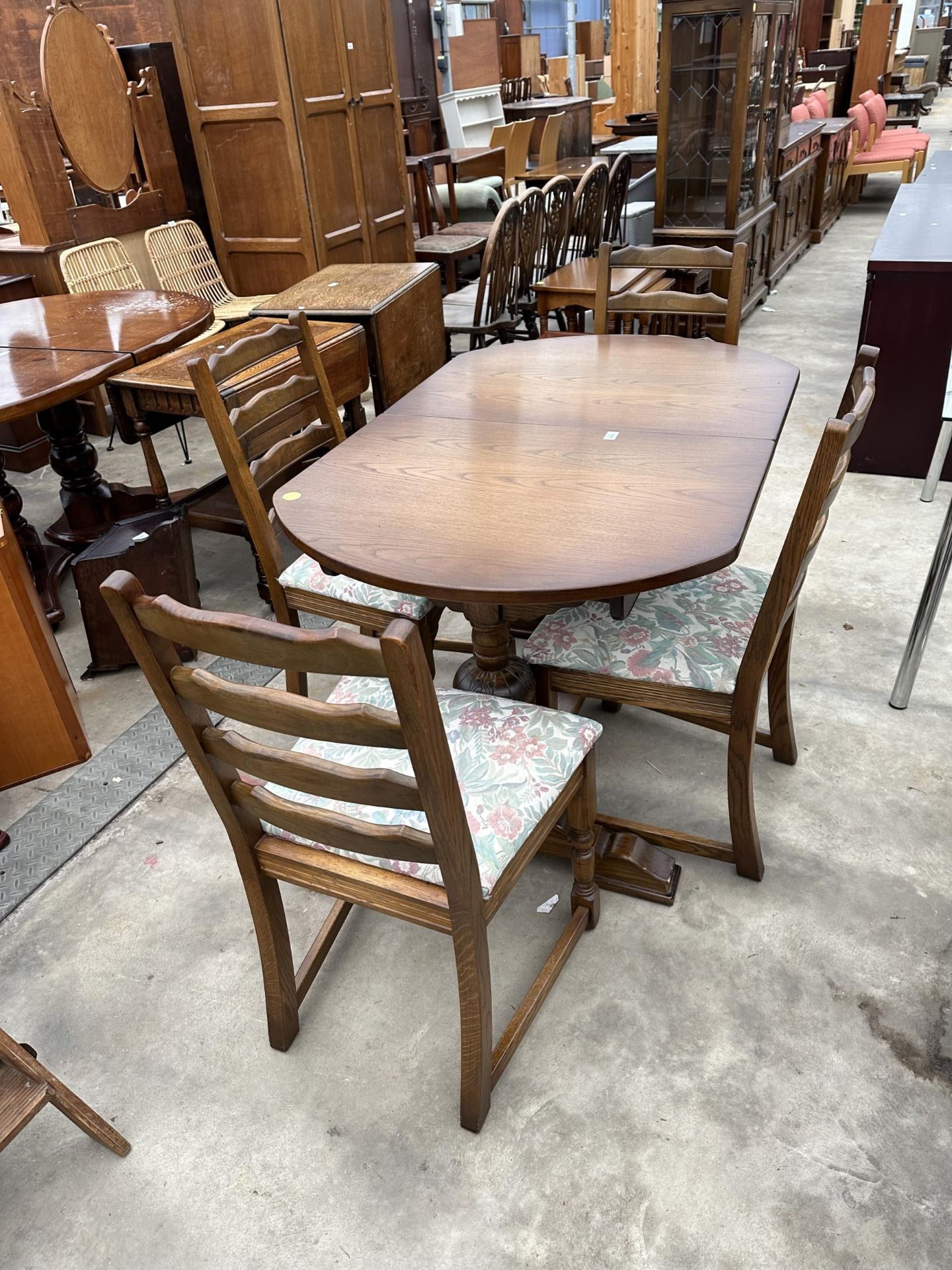 AN OAK OLD CHARM STYLE EXTENDING DINING TABLE, 50 X 32" (LEAF 15") AND FOUR LADDERBACK DINING CHAIRS