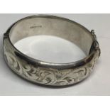 A HEAVY SILVER BANGLE