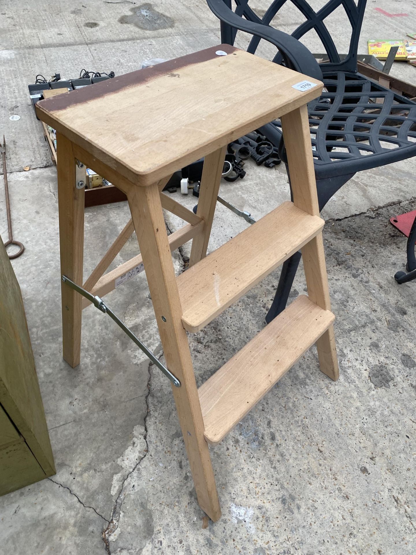 A SMALL WOODEN TWO RUNG STEP SEAT
