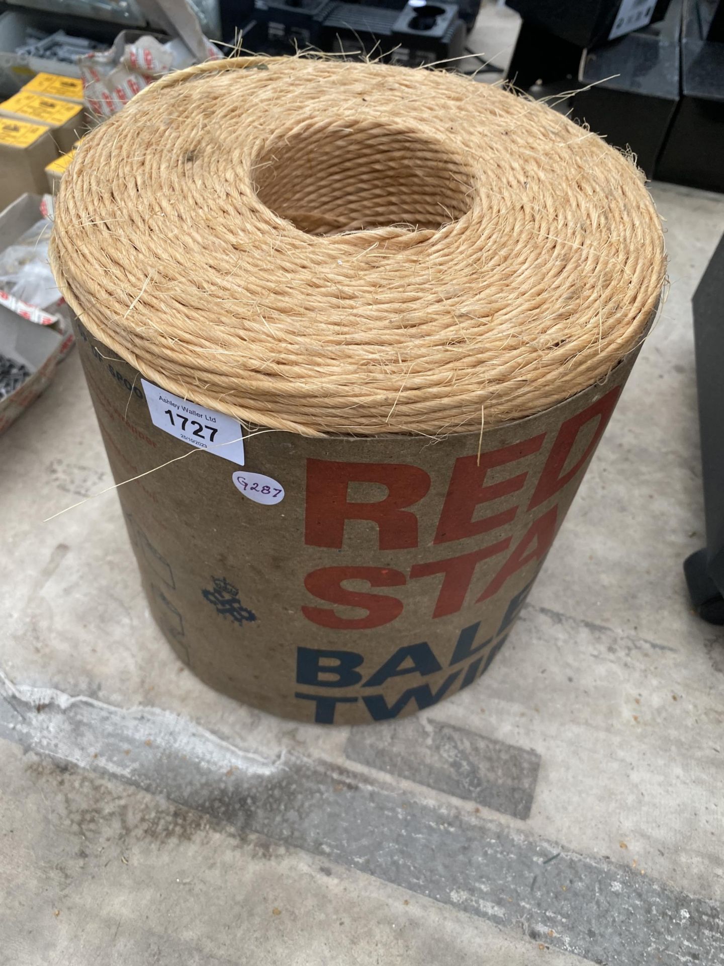 A ROLL OF RED STAR HESIAN BALER TWINE