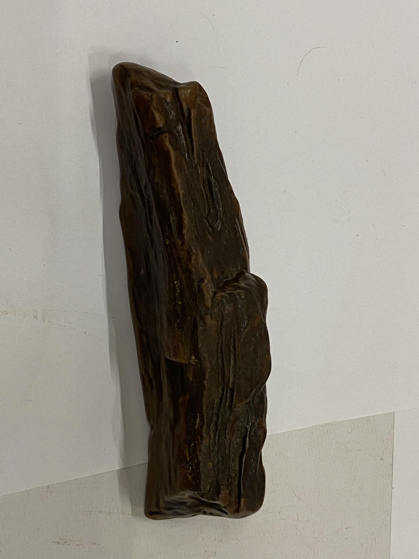 A VINTAGE PIECE OF PETRIFIED WOOD, LENGTH 13CM