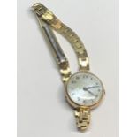 A VINTAGE WRIST WATCH WITH 9 CARAT GOLD CASE AND GOLD PLATED STRAP