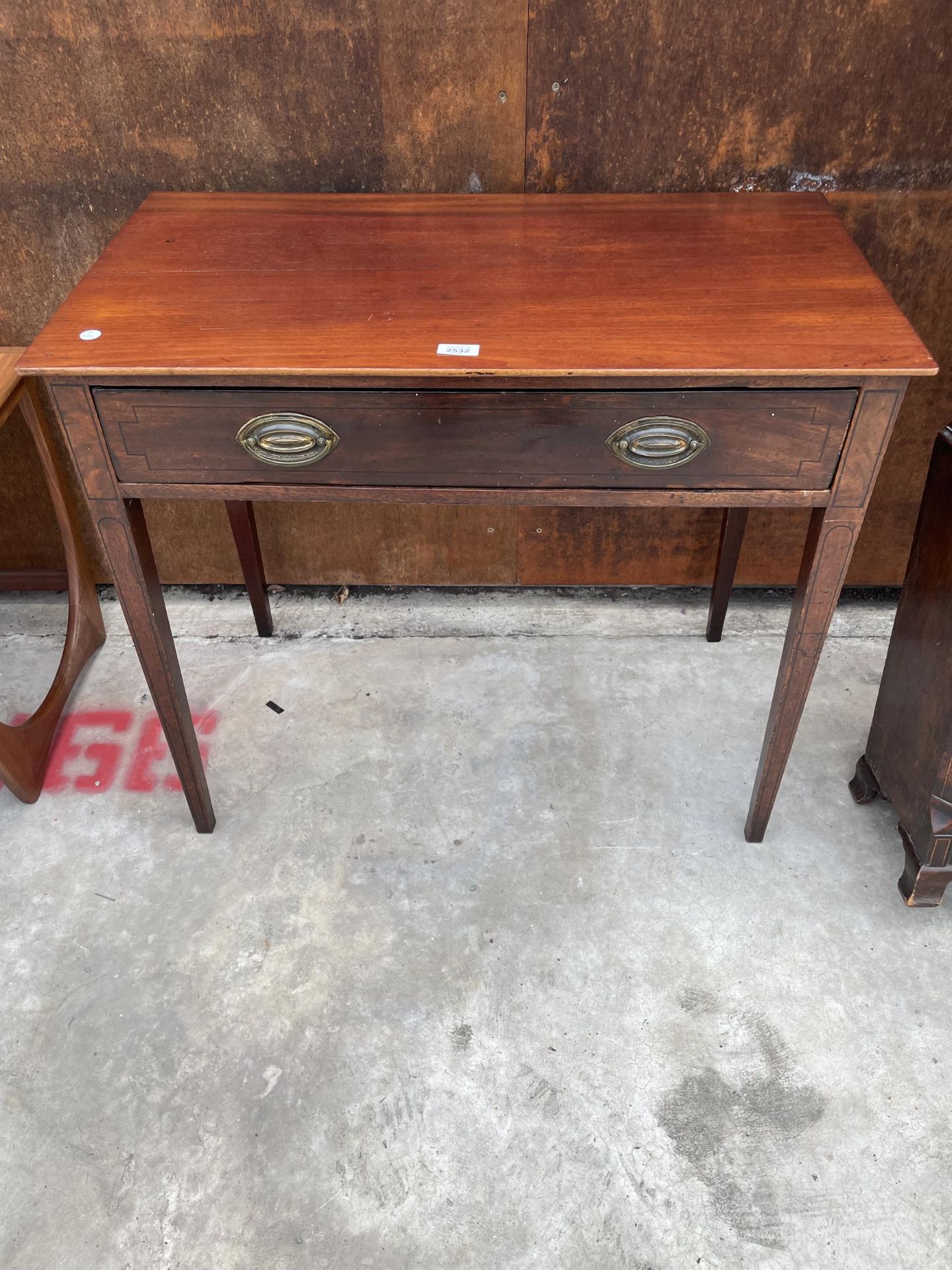 A 19TH CENTURY MAHOGANY AND INLAID SIDE-TABLE WITH SINGLE DRAWER AND LATER TOP, 33" WIDE, ON