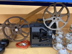 A VINTAGE BELL & HOWELL FILM PROJECTOR WITH A 16MM FILMOSOUND