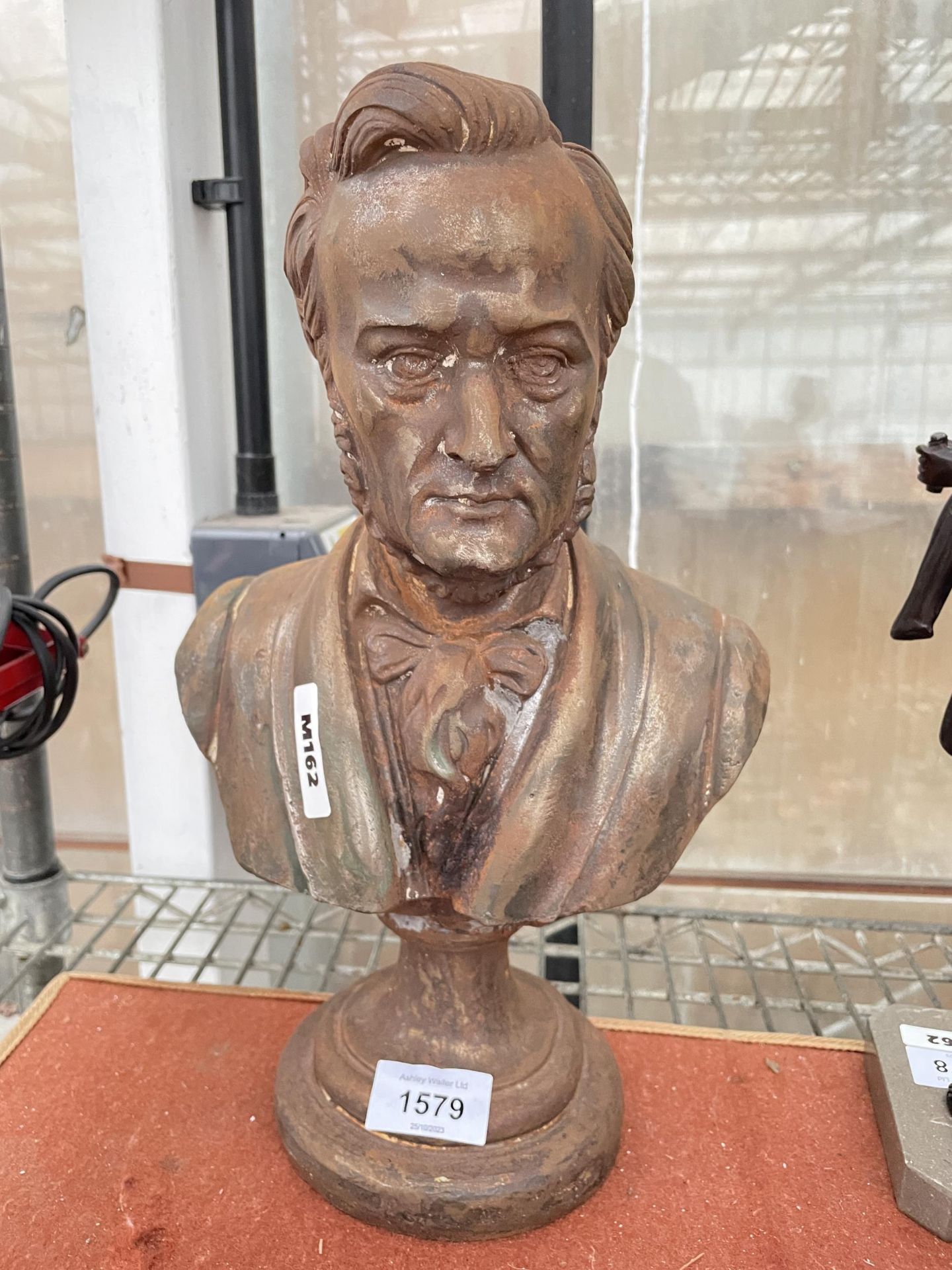 A VINTAGE CAST IRON BUST OF A MALE