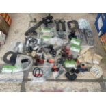 A LARGE ASSORTMENT OF HARDWARE TO INCLUDE A ROUTER GUIDE, A CHAINSAW BAR AND BRACKETS ETC