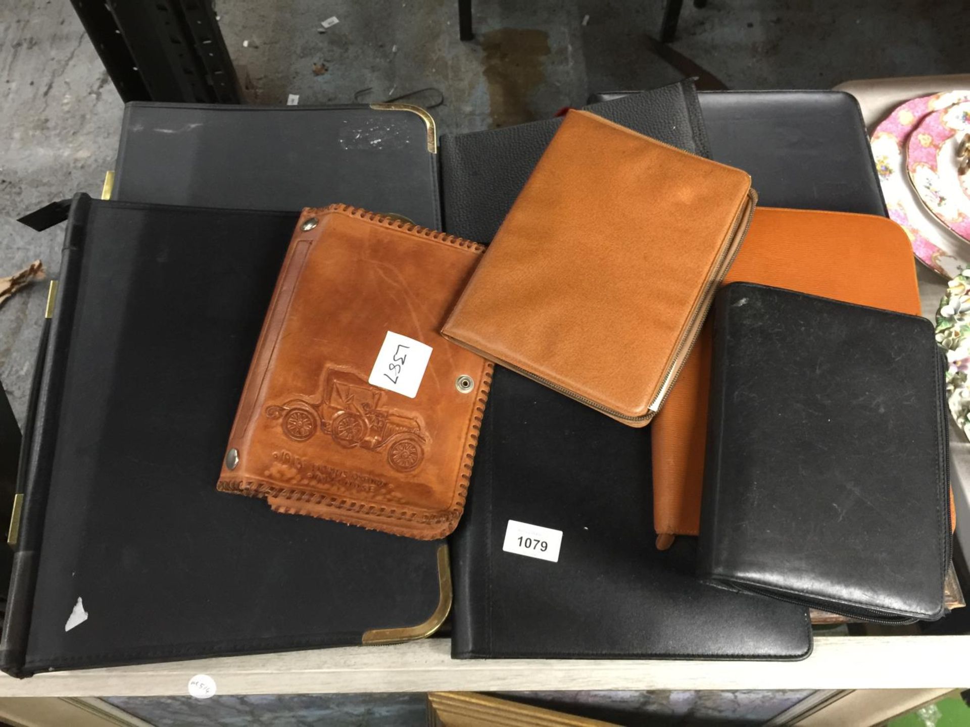 A QUANTITY OF FOLDERS TO INCLUDE LEATHER