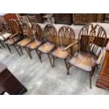 A SET OF SIX MODERN WHEELBACK WINDSOR STYLE CHAIRS, TWO BEING CARVERS