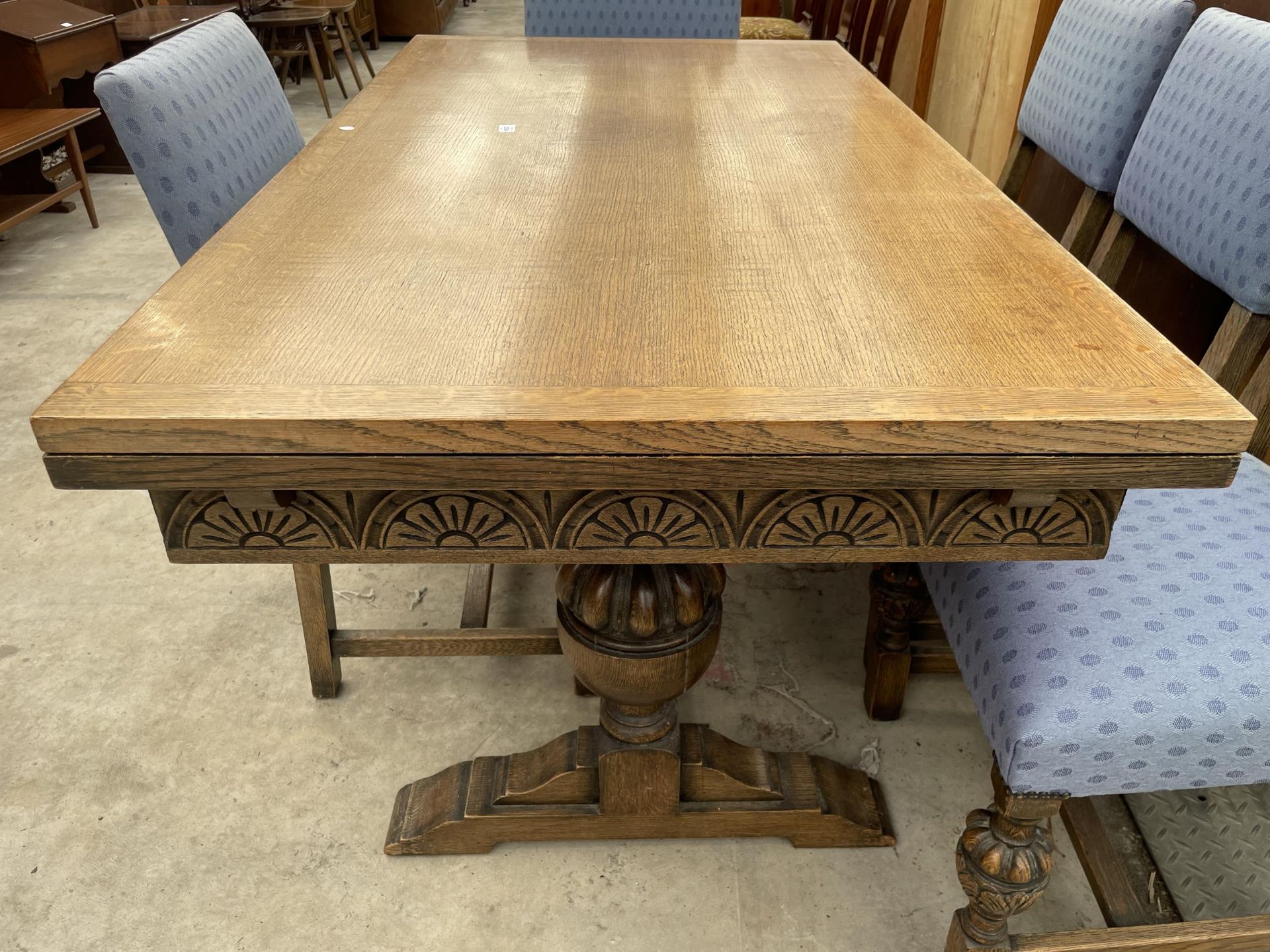 AN EARLY 20TH CENTURY OAK TWIN-PEDESTAL DRAW-LEAF DINING TABLE AND SIX CHAIRS, TWO BEING CARVERS, 60 - Image 8 of 9
