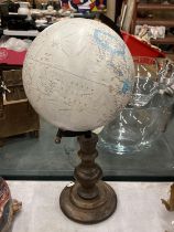 A GLOBE ON A WOODEN BASE, HEIGHT APPROX 41CM