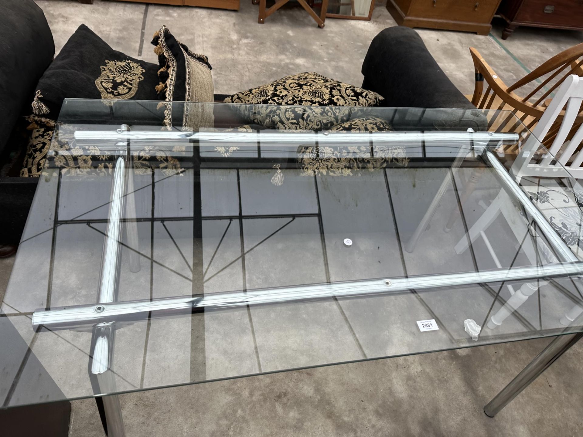 A RETRO DINING TABLE WITH GLASS TOP ON TUBULAR POLISHED CHROME BASE, 55 X 31.5" - Image 2 of 3