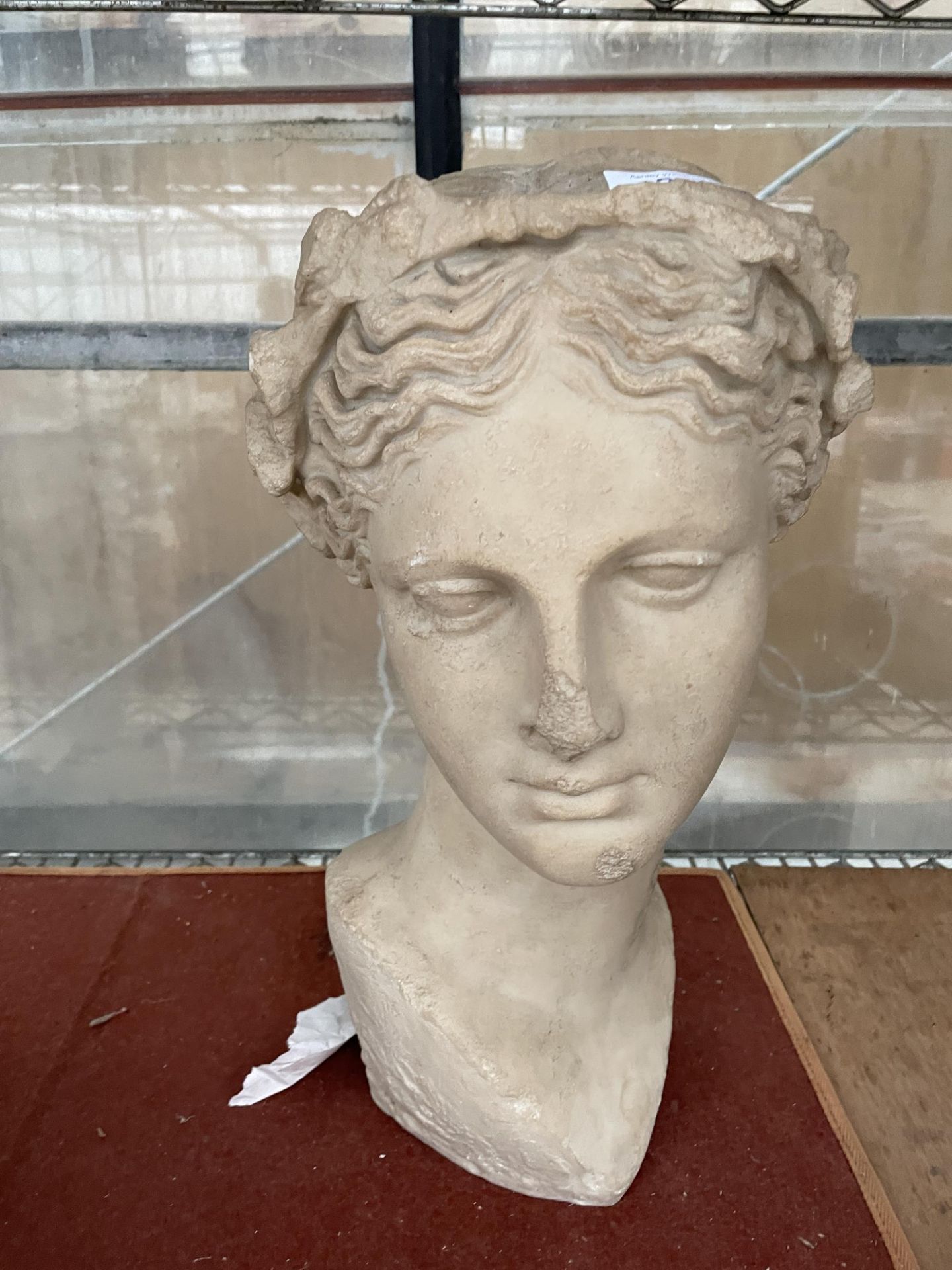 A SMALL RESIN BUST OF A FEMALE FIGURE (H:38CM)