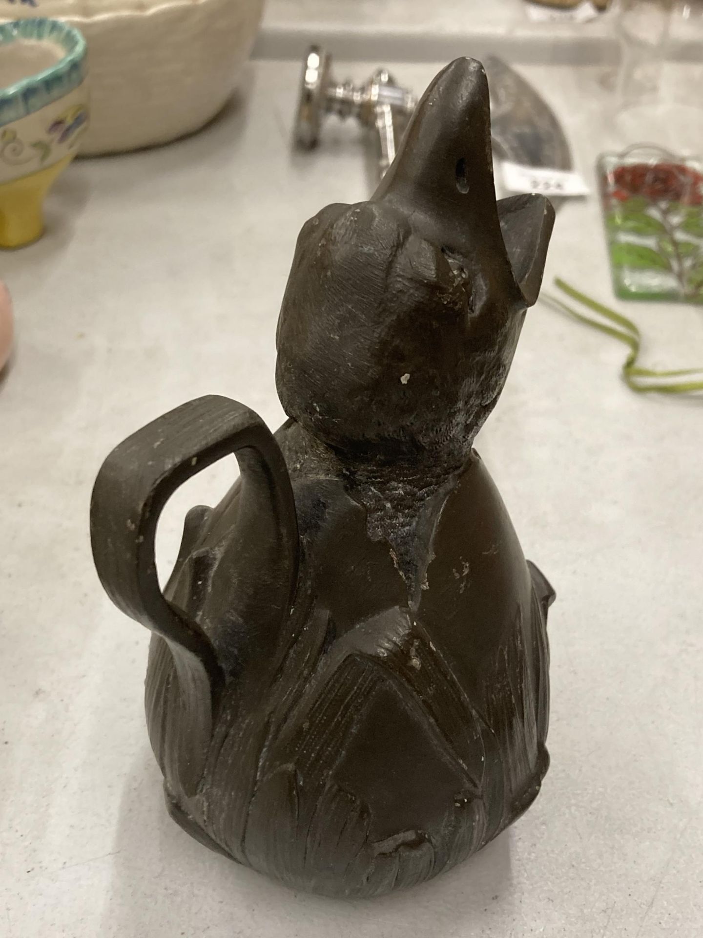 A VINTAGE METAL JUG DESIGNED AS A BIRD HATCHING, STAMPED TO BASE - Image 3 of 4