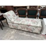 A DAY BED OTTOMAN WITH FLORAL DESIGN
