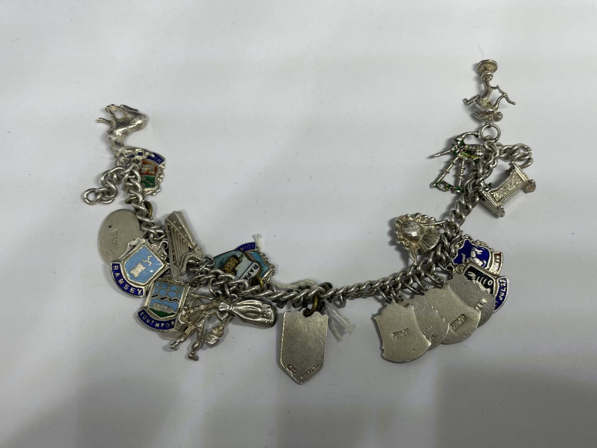 A SILVER CHARM BRACELET WITH TWENTY FOUR VARIOUS CHARMS WEIGHT 48.2 GRAMS - Image 2 of 2