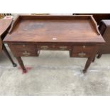 A VICTORIAN MAHOGANY DESK ENCLOSING FIVE DRAWERS, WITH GALLERY BACK, ON TURNED LEGS, 45 X 22.5"