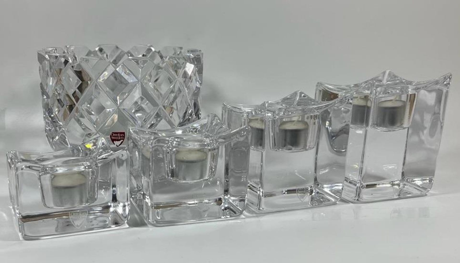 A SET OF VINTAGE ORREFORS POLARIS ICE CUBE CANDLE HOLDERS AND AN ORREFORS SOFIERO CUT GLASS BOWL,