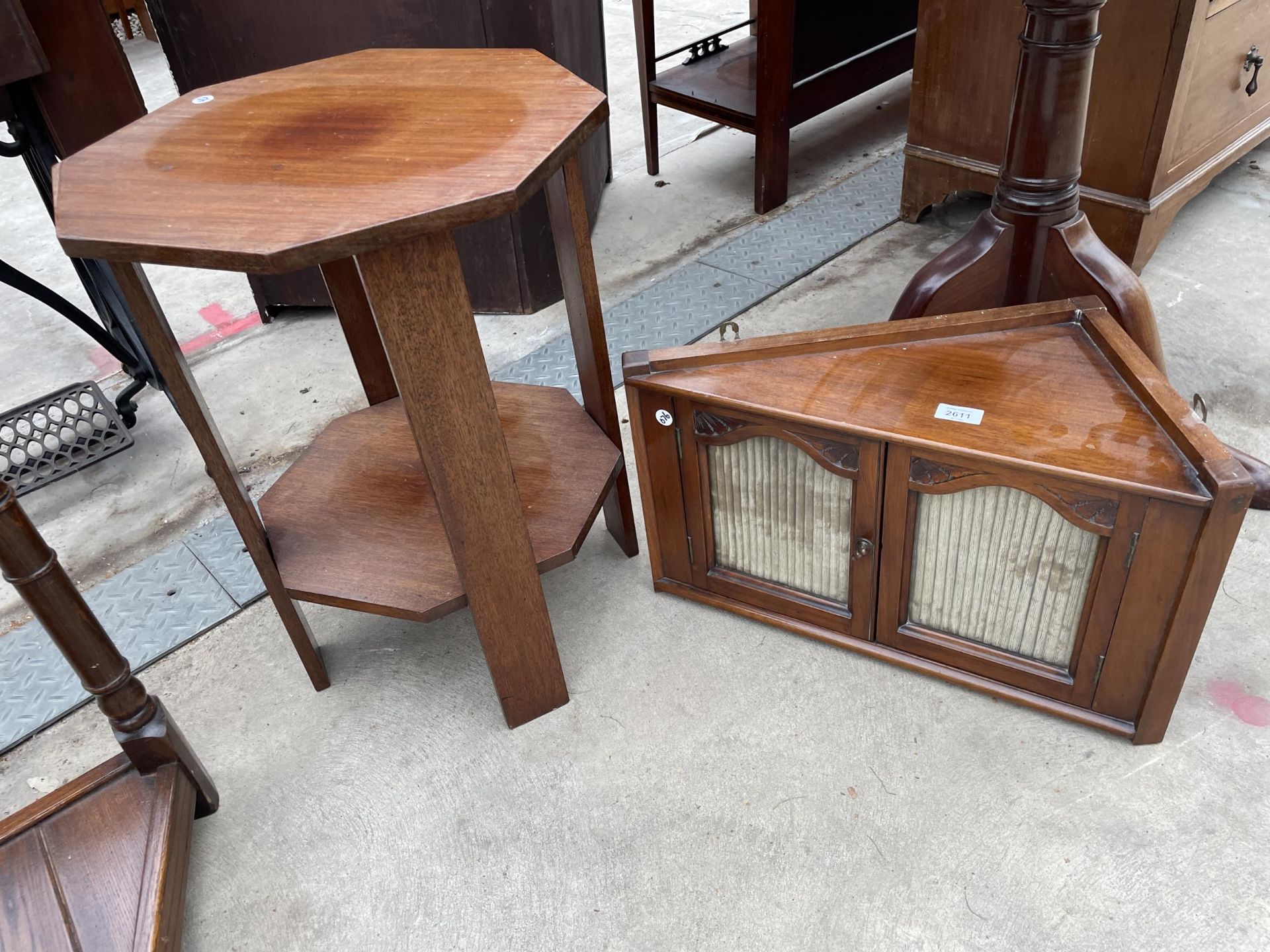 AN OCTAGONAL MAHOGANY TWO TIER TABLE AND LATE VICTORIAN MAHOGANY WALL CABINET WITH GLASS DOORS