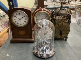 A VINTAGE BRASS LANTERN CLOCK, A CARRIAGE CLOCK AND TWO WOODEN MANTLE CLOCKS