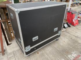 A LARGE HARDCASED FOUR WHEELED TRANSPORTATION CASE