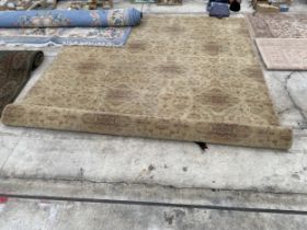 A LARGE YELLOW PATTERNED RUG