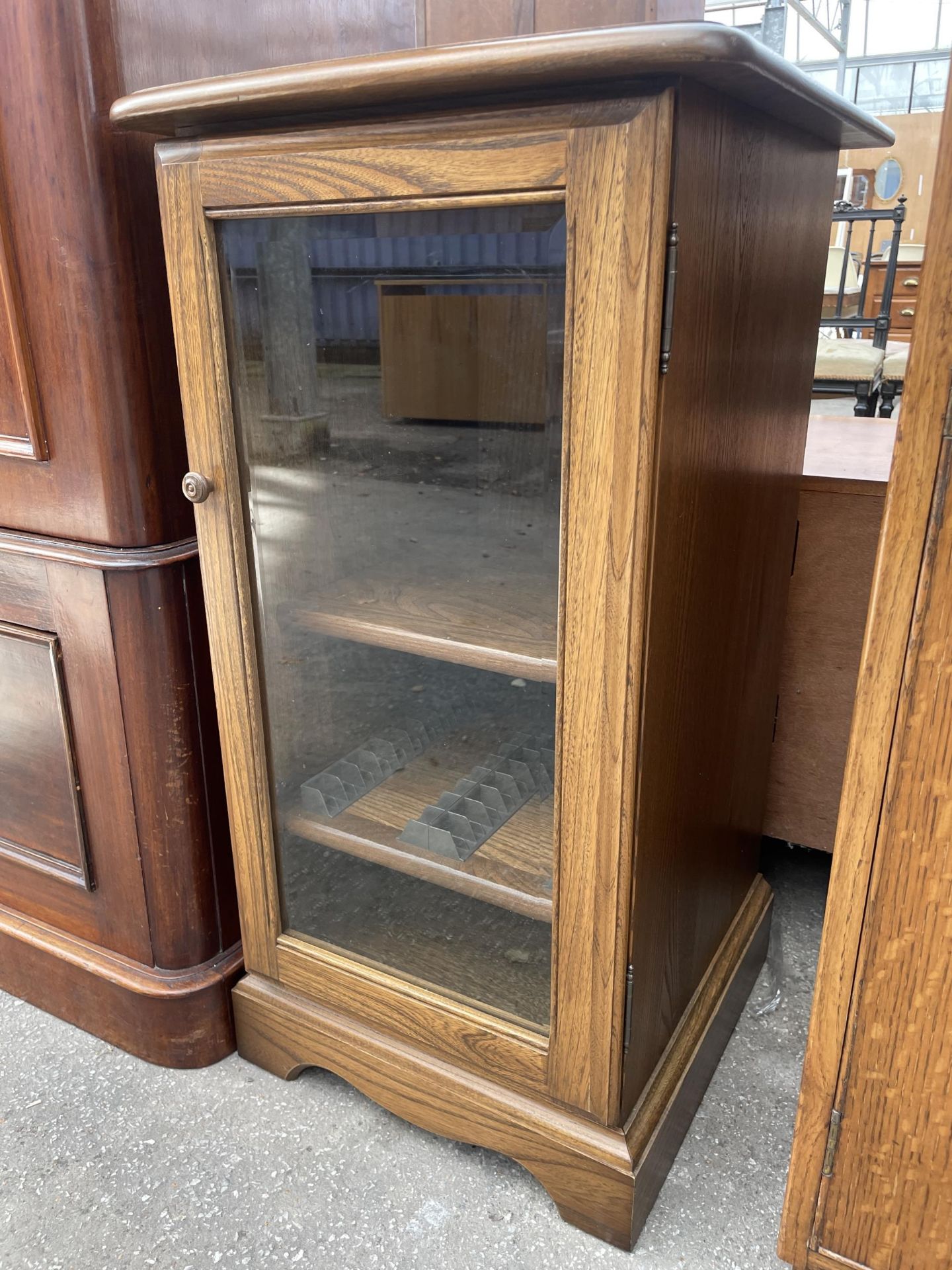 AN ERCOL ELM CABINET WITH GLASS DOOR, 17" WIDE - Image 2 of 2