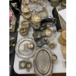 A LARGE QUANTITY OF SILVER PLATED AND WHITE METAL ITEMS TO INCLUDE TEAPOTS, JUGS, TEA STRAINERS, ETC