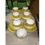 SIX VINTAGE YELLOW BONE CHINA TRIOS PLUS AN EXTRA CUP