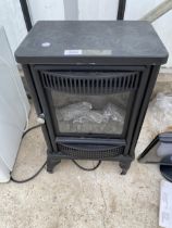 AN ELECTRIC HEATER IN THE FORM OF A LOG BURNER