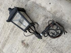 A VINTAGE STYLE OUTDOOR COURTYARD LIGHT WITH BRACKET