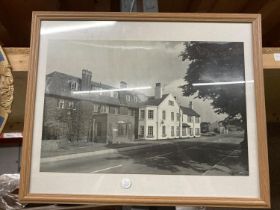 A FRAMED BLACK AND WHITE PHOTO OF AN OLD RAC BUILDING