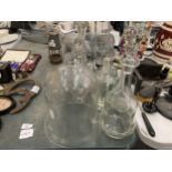 A COLLECTION OF GLASS ITEMS TO INCLUDE CLOCHE DOME, DECANTER, BOTTLES ETC