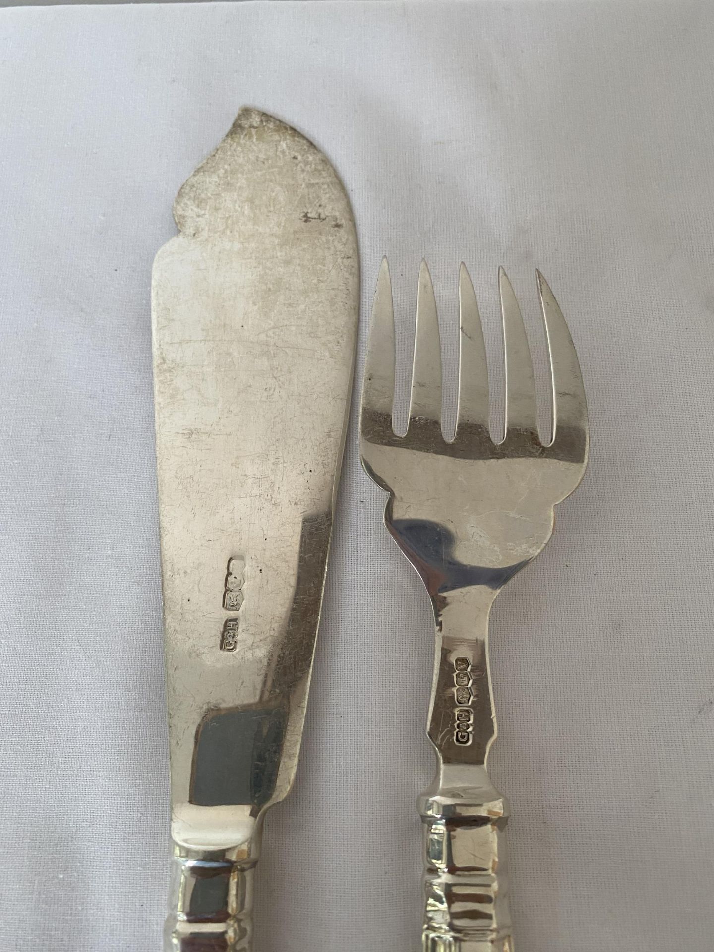 A PAIR OF ELIZABETH II 1963 HALLMARKED SHEFFIELD SILVER FISH KNIFE AND FORK, MAKER GEE & HOLMES, - Image 10 of 15