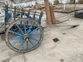 A VINTAGE INDIAN HARDWOOD TWO WHEELED CART