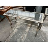A MODERN POLISHED METALWARE CONSOLE TABLE ON X-FRAME