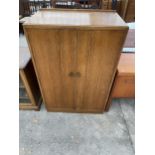 A MID 20TH CENTURY OAK SMALL TWO DOOR WARDROBE, 33" WIDE