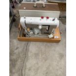 A NEW HOME ELECTRIC SEWING MACHINE WITH FOOT PEDAL AND CARRY CASE
