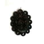 A VINTAGE WHITBY JET BROOCH