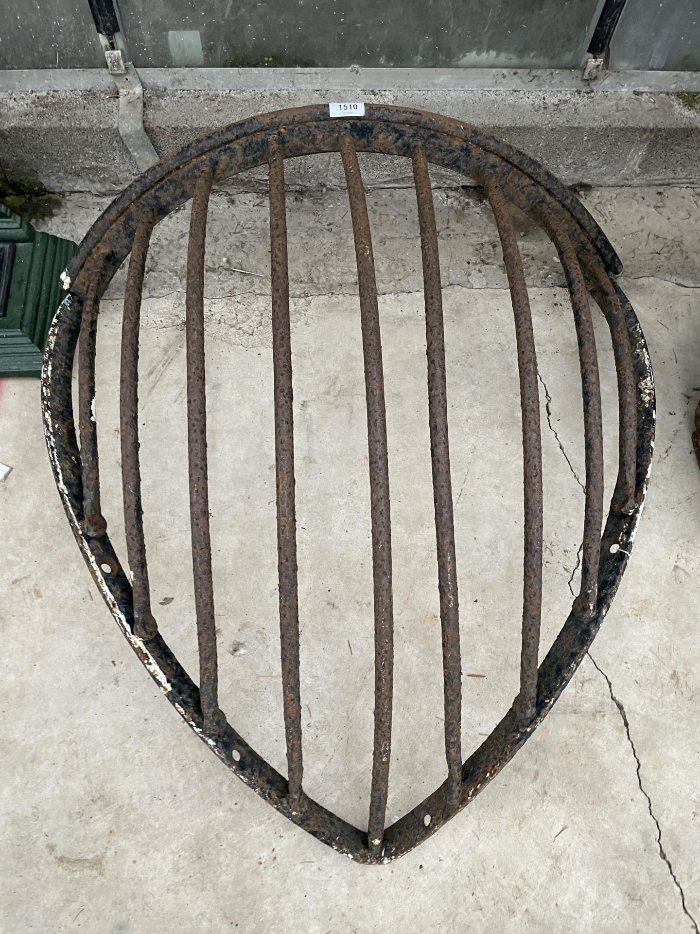 A VINTAGE CAST IRON CORNER HAYRACK