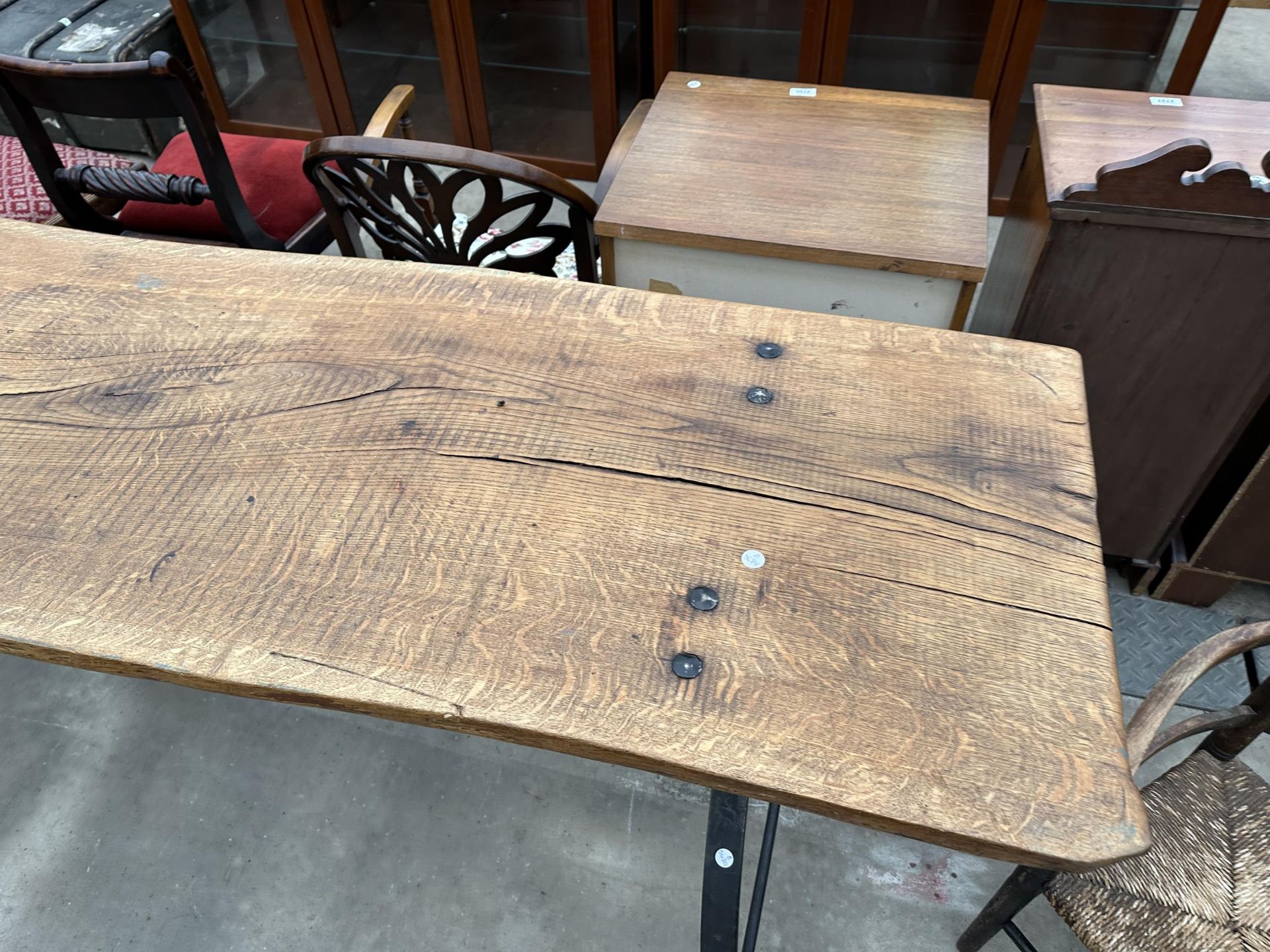 A LARGE RUSTIC DINING TABLE WITH CAST IRON STIRRUP SHAPED END LEGS, 86 X 22" - Image 2 of 5