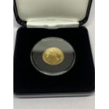 A YELLOW METAL VICTORIA COIN