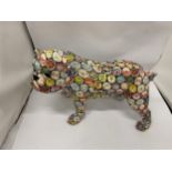 A LARGE BULLDOG WITH CONTINENTAL BOTTLE TOP DECORATION, HEIGHT 26CM, LENGTH 37CM