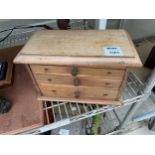 A VINTAGE PINE APPRENTICE CHEST OF THREE DRAWERS WITH SECRET LOCK