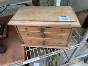 A VINTAGE PINE APPRENTICE CHEST OF THREE DRAWERS WITH SECRET LOCK