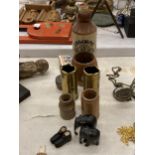 A MIXED VINTAGE LOT TO INCLUDE A MINIATURE PAIR OF SHOES, TRENCH ART SMALL VASES, STONEWARE BOTTLES,