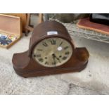 A VINTAGE OAK CASED CHIMING MANTLE CLOCK