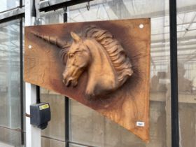 A LEATHER COVERED WALL HANGING OF A UNICORN