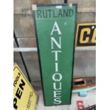 A WOODEN HAND PAINTED 'RUTLAND ANTIQUES' SIGN
